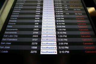 LOS ANGELES-CA-DECEMBER 29, 2022: Canceled Southwest Airlines flights appear on the monitors at LAX on Thursday, December 29, 2022. (Christina House / Los Angeles Times)