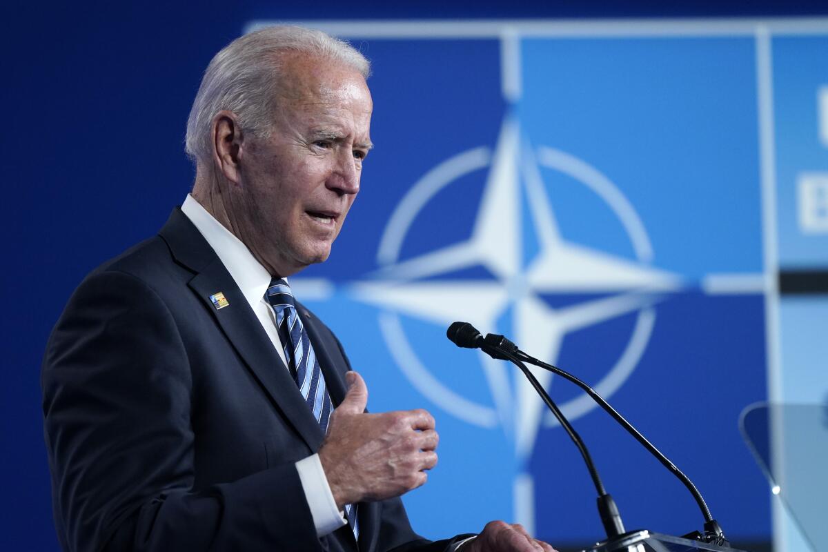 President Biden speaks during a news conference at the NATO summit in Brussels.