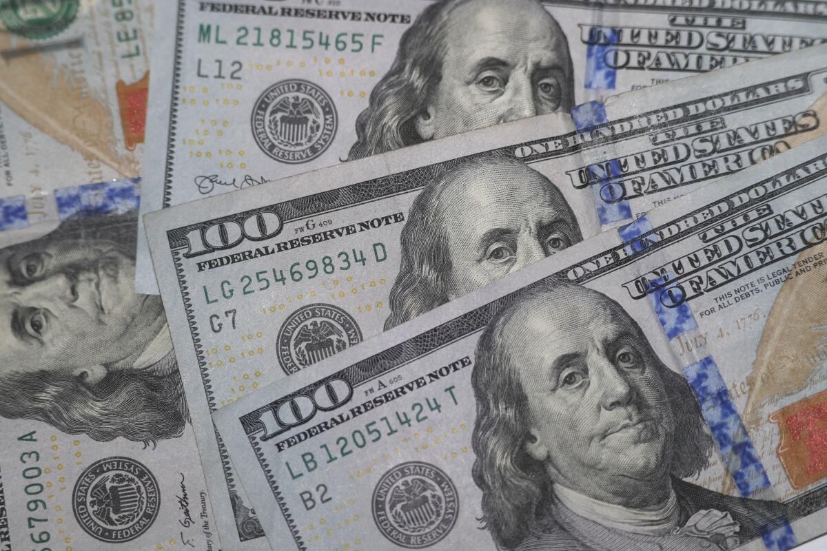 A pile of $100 bills
