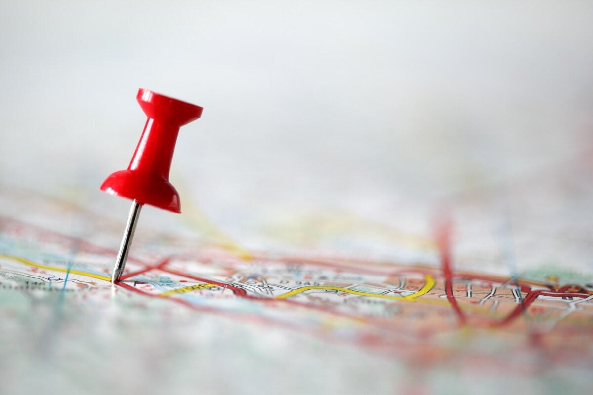 A red pushpin in a map