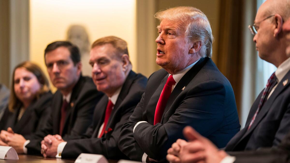 President Trump speaks during a meeting with leaders from the steel and aluminum manufacturing industries at the White House.