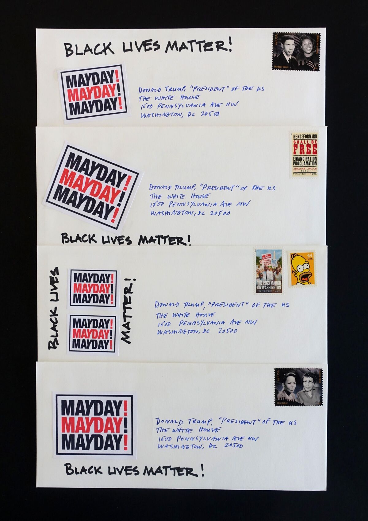 A photograph shows an overhead view of four envelopes addressed to the White House emblazoned with the word "Mayday!"