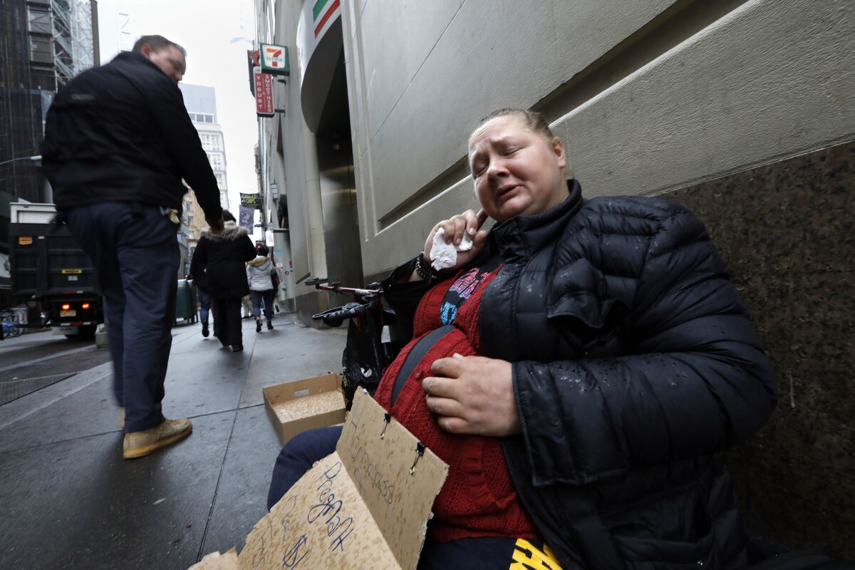 Laura Miller, age 36, is homeless and gets by panhandling in the financial district of Manhattan.