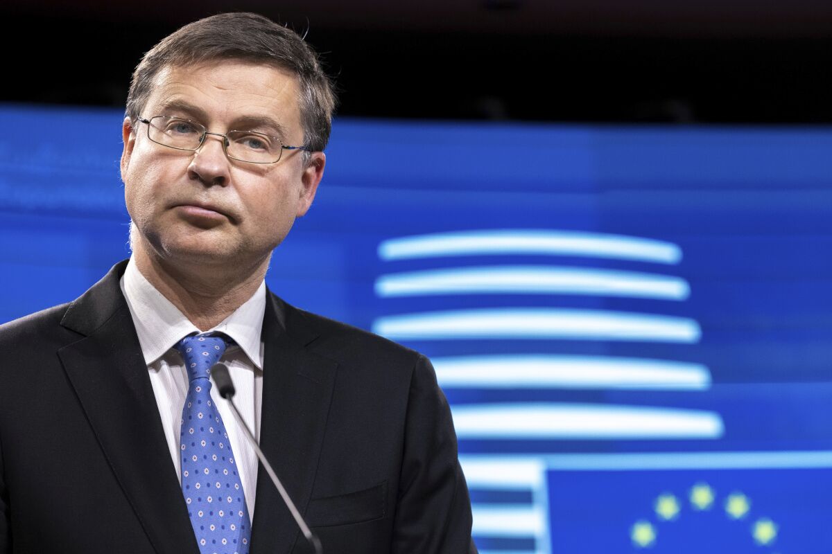 FILE - EU Trade Commissioner Valdis Dombrovskis speaks during a press conference after the Economic and Financial Affairs Council meeting at the Europa building in Brussels, on Dec. 7, 2021. The European Union wants to set up a system of trade sanctions that it could impose on any foreign power it accuses of trying to coerce the 27-country bloc for economic or political gain. The EU’s executive branch, the European Commission, wants to be able to react without needing the endorsement of all member nations when a person, company or country tries to strong-arm the bloc. It says such a plan could be used in situations like China’s diplomatic and trade spat with Lithuania over Taiwan. (AP Photo/Olivier Matthys, File)