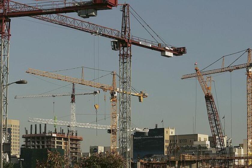 Cranes rise from several downtown construction sites.