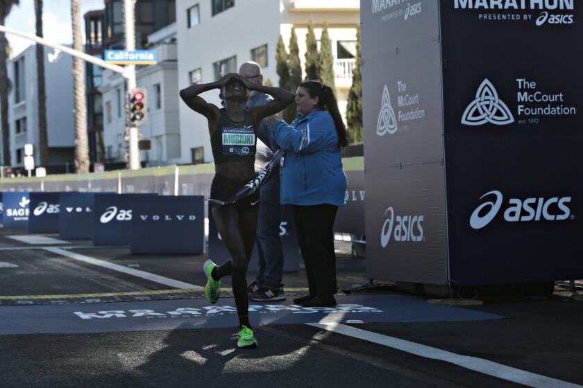 Santa Monica, CA., March 8, 2020 - Margaret Muriuki, 33 of Kenya completes the 2020 Los Angeles Marathon on Sunday, March 8, 2020 in Santa Monica, California. (Jason Armond / Los Angeles Times)