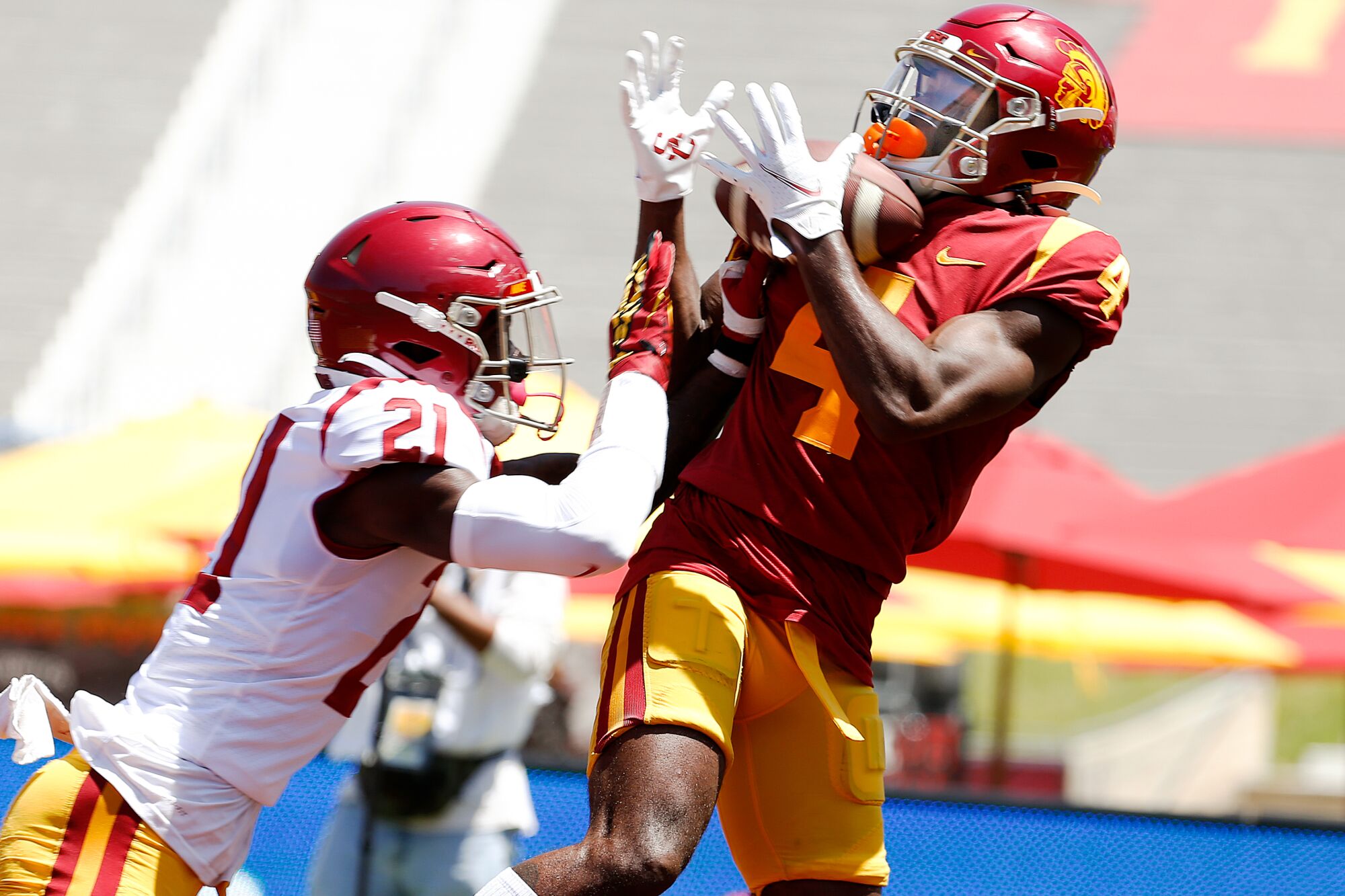 Mario Williams catches a touchdown pass while covered by defensive back Latrell McCutchin in the USC Spring Game on Saturday.