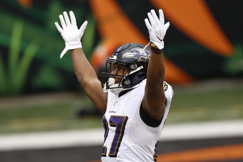 Baltimore Ravens running back J.K. Dobbins (27) celebrates after scoring a touchdown against the Cincinnati Bengals during the second half of an NFL football game, Sunday, Jan. 3, 2021, in Cincinnati. (AP Photo/Aaron Doster)