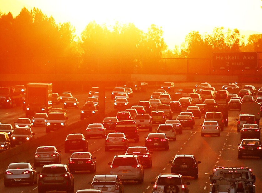 Traffic swells on the 101 Freeway near White Oak in the San Fernando Valley as the sun comes up in March 2015.