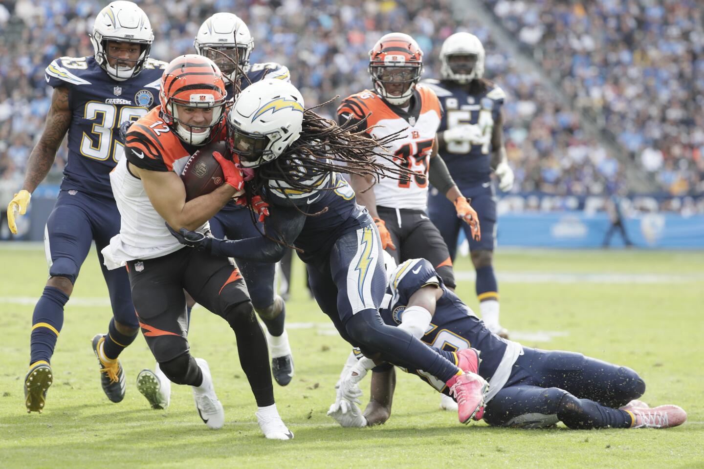 Bengals receiver Alex Erickson is tackled by Chargers safety Jahleel Addae during the second half.