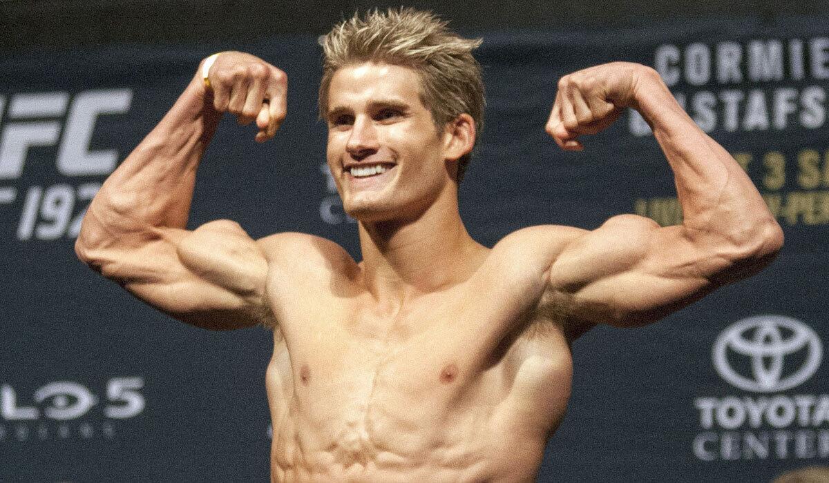 Sage Northcutt flexes his muscles during the weigh-in for UFC 192 in Houston on Oct. 2.