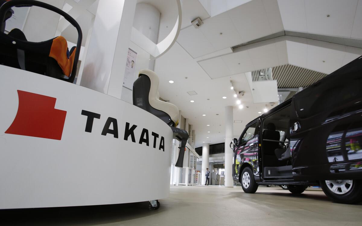 Stefan Stocker, president of air-bag maker Takata Corp., has stepped down and will be replaced by company CEO Shigehisa Takada. Above, Takata child seats on display at a Toyota showroom in Tokyo last month.