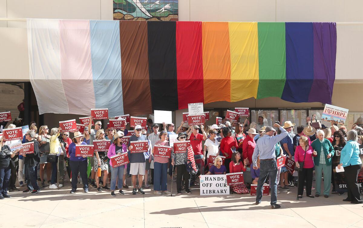 The grass-roots group Protect Huntington Beach gathers for a press conference at Huntington Beach City Hall.