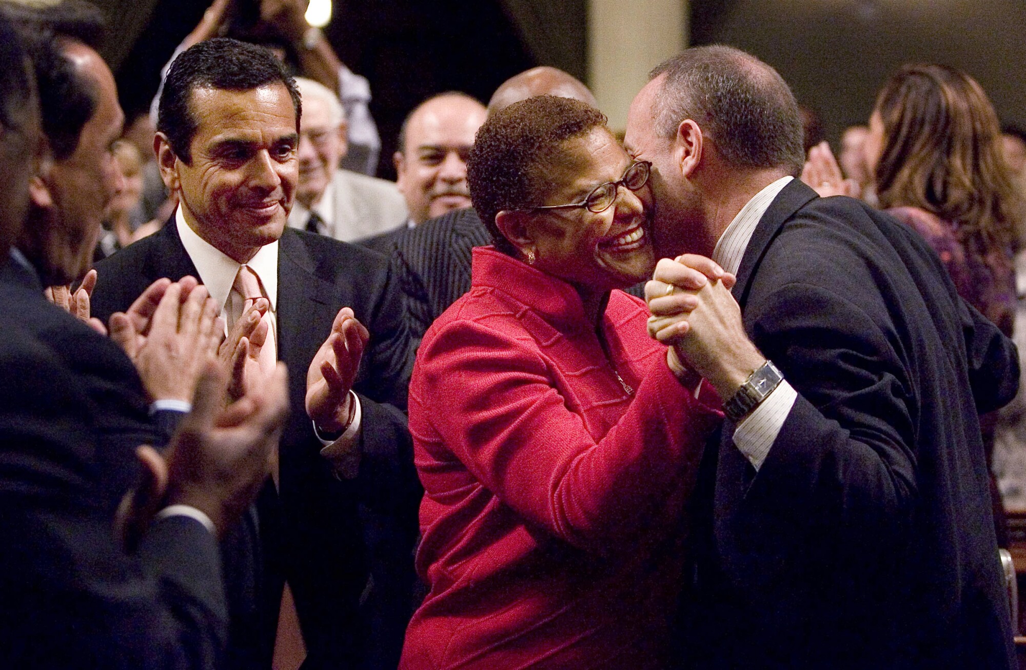 Colleagues applaud Karen Bass in the state Assembly.