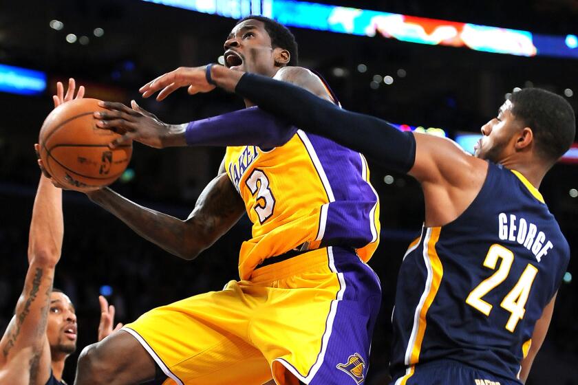 While with the Lakers on a 10-day contract, guard Manny Harris puts up a shot in January 2014 during a loss to the Indiana Pacers.