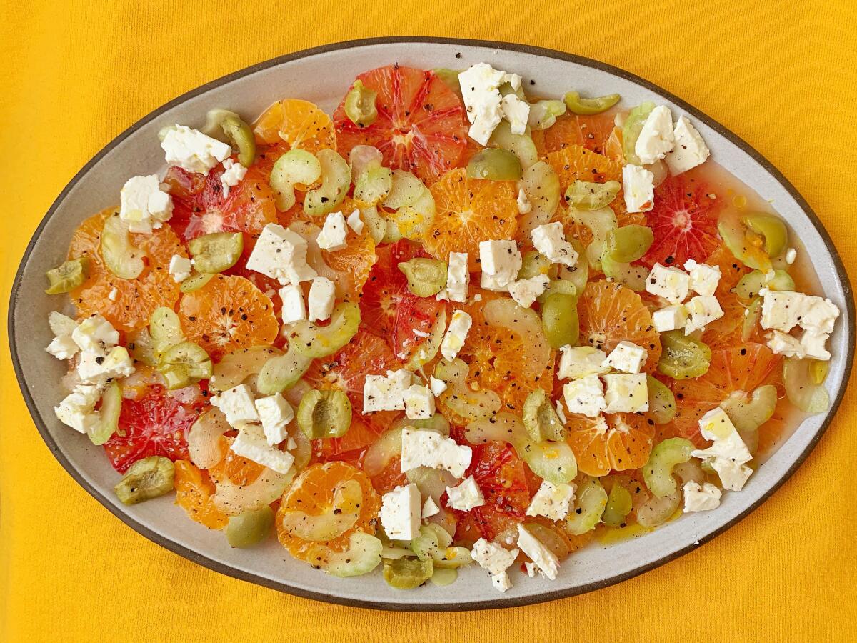 A salad of sweet orange citrus marinated in a salty-things vinaigrette with feta, celery, anchovies, olives and capers.
