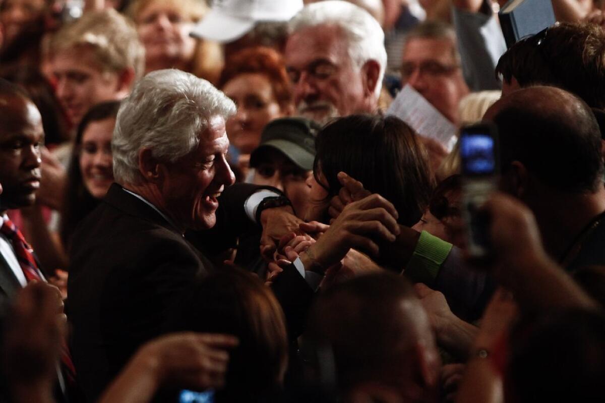 Former President Clinton greets supporters after speaking in support of President Obama during a campaign event in Fort Myers, Fla.