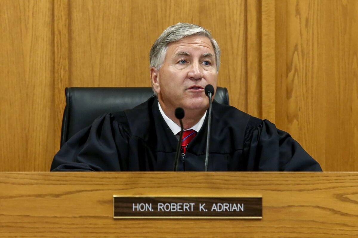Judge Robert Adrian presides over court on Aug. 26, 2020, in Adams County, Ill. Adrian, who found an 18-year-old man guilty of sexual assaulting a 16-year-old girl, has come under fire after he later threw out the conviction this month, saying the 148 days the man spent in jail was punishment enough. (Jake Shane/Quincy Herald-Whig via AP)