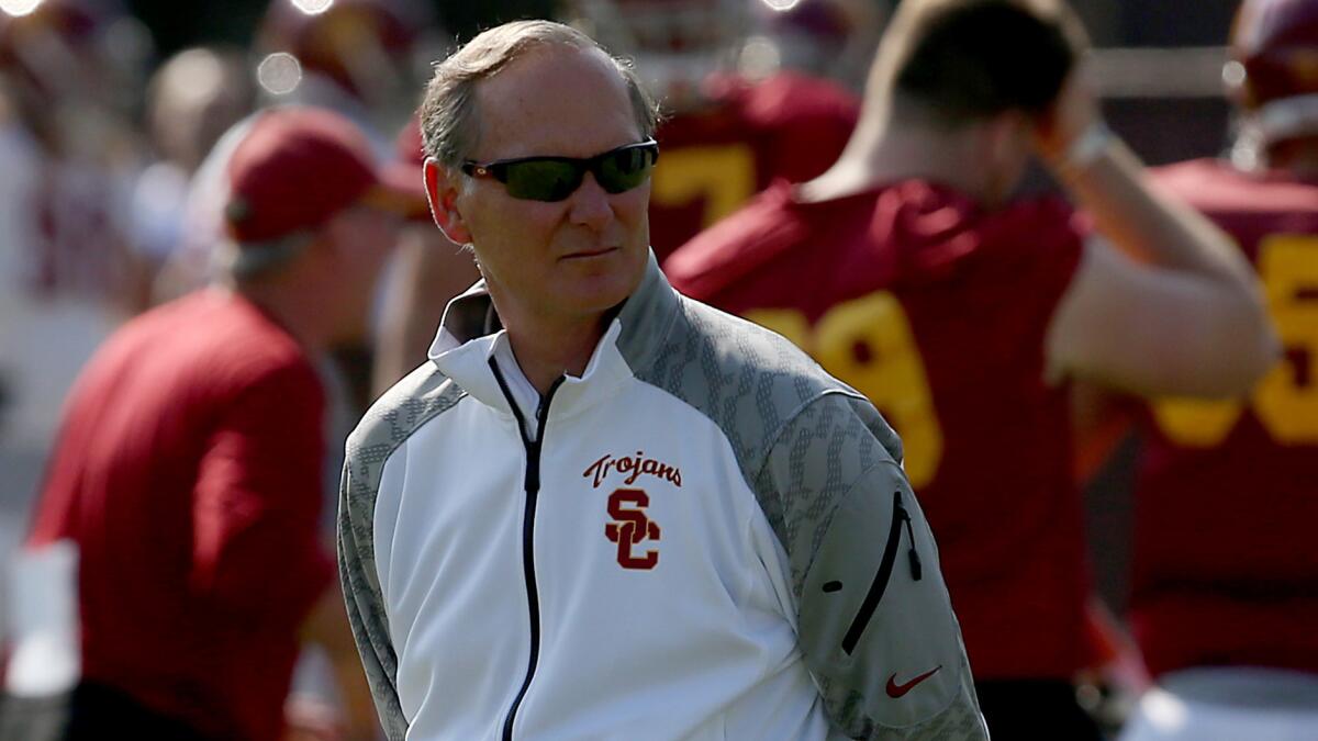 USC Athletic Director Pat Haden, shown at a football practice in October 2013, has stayed mostly silent about the university's scandal.