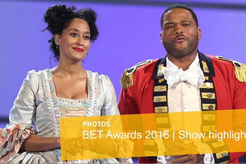 Hosts Tracee Ellis Ross and Anthony Anderson perform a skit dressed as characters from the musical "Hamilton" at the BET Awards at the Microsoft Theater.