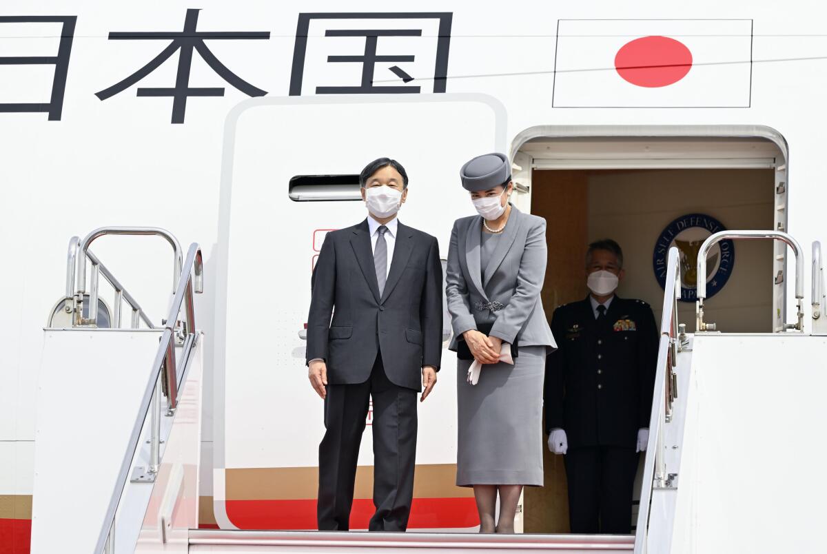 Japanese Emperor Naruhito and Empress Masako prepare to leave for Britain, at Haneda airport in Tokyo Saturday, Sept. 17, 2022. They will attend Queen Elizabeth II’s state funeral to pay respects to her. (Kyodo News via AP)