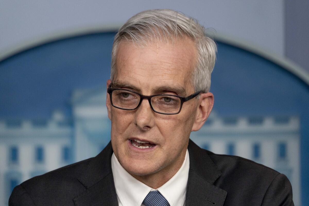 Denis McDonough speaks at a news briefing.