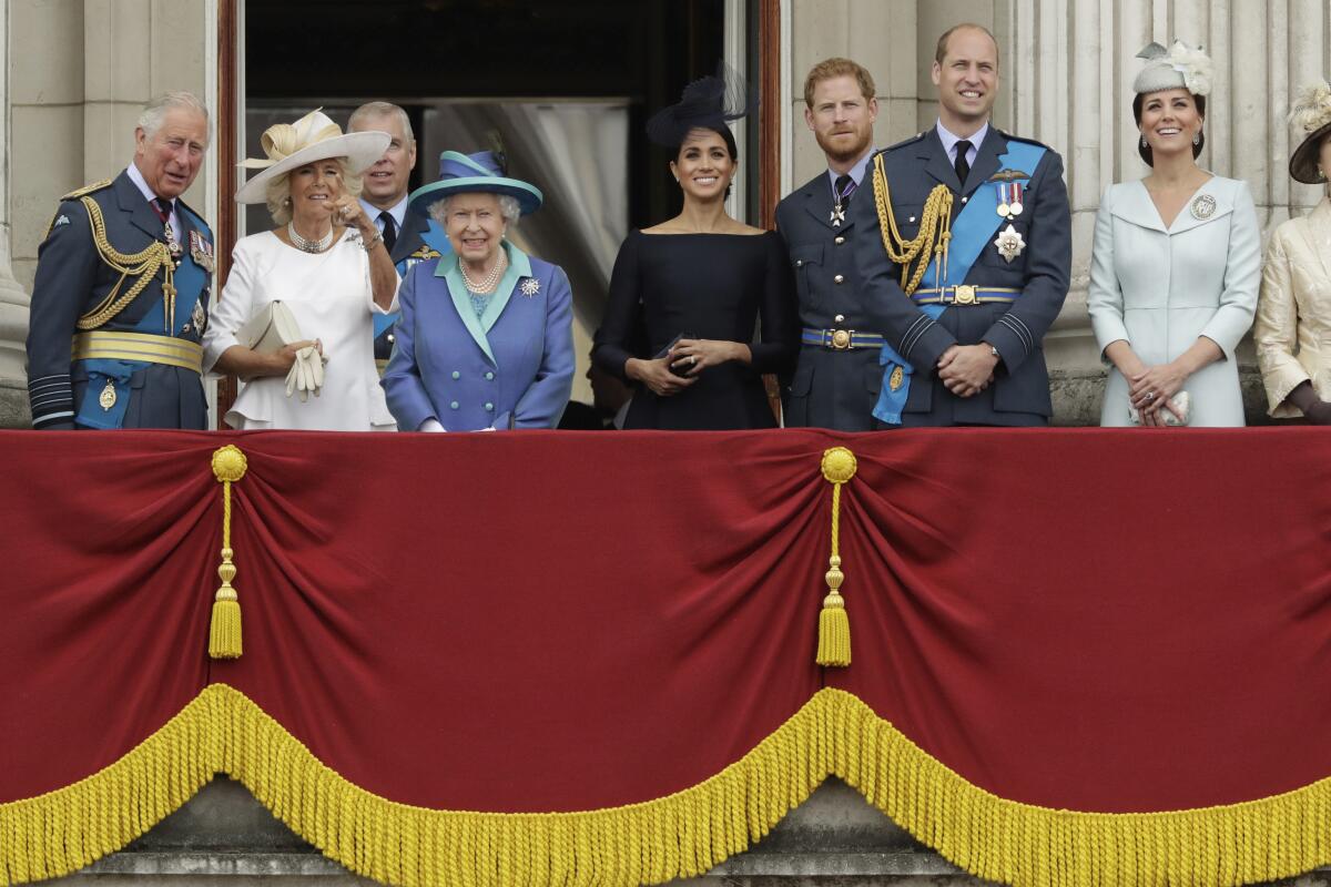 FILE - In this Tuesday, July 10, 2018 file photo, members of THE royal family gather on the balcony of Buckingham Palace, with from left, Britain's Prince Charles, Camilla the Duchess of Cornwall, Prince Andrew, Queen Elizabeth II, Meghan the Duchess of Sussex, Prince Harry, Prince William and Kate the Duchess of Cambridge, as they watch a flypast of Royal Air Force aircraft pass over Buckingham Palace in London. The timing couldn’t be worse for Harry and Meghan. The Duke and Duchess of Sussex will finally get the chance to tell the story behind their departure from royal duties directly to the public on Sunday, March 7, 2021 when their two-hour interview with Oprah Winfrey is broadcast. (AP Photo/Matt Dunham, File)