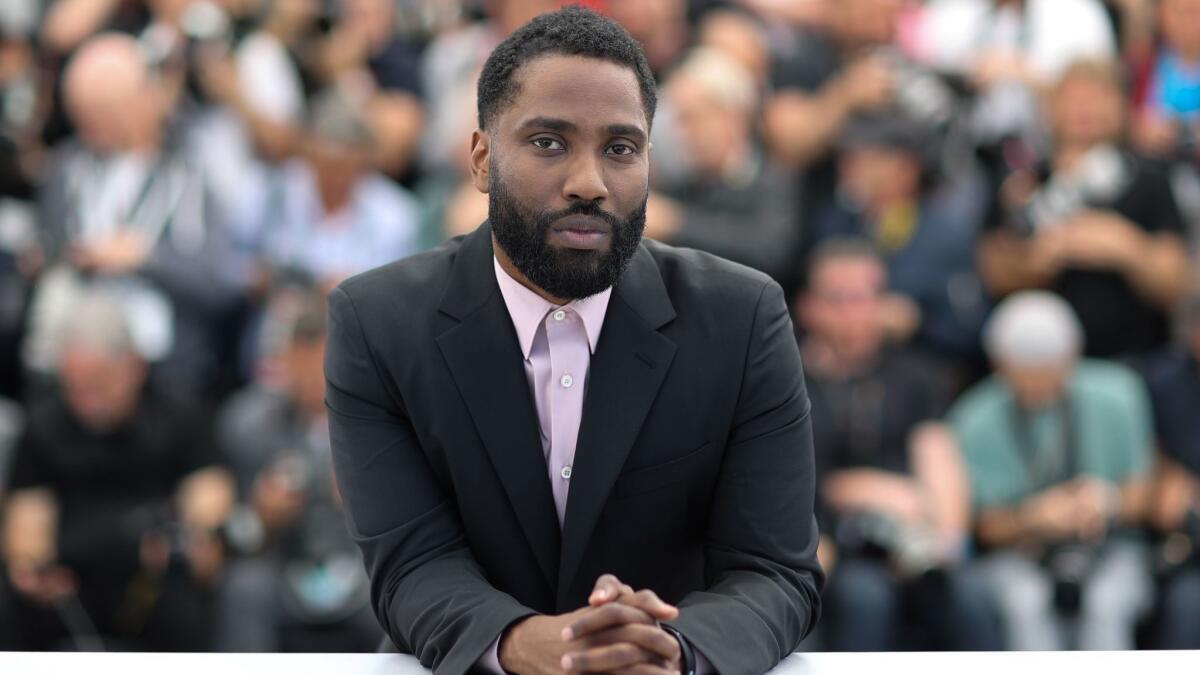 John David Washington poses during a photocall for the film "BlacKkKlansman" at the 71st edition of the Cannes Film Festival.