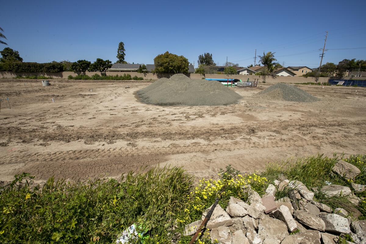 A vacant plot of land where new townhomes are being built on Talbert Avenue in Huntington Beach.
