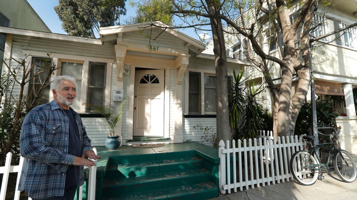 John Okulick stands outside a home located in the Venice Beach Business Improvement District. Its owner is among the plaintiffs suing to dissolve the district.