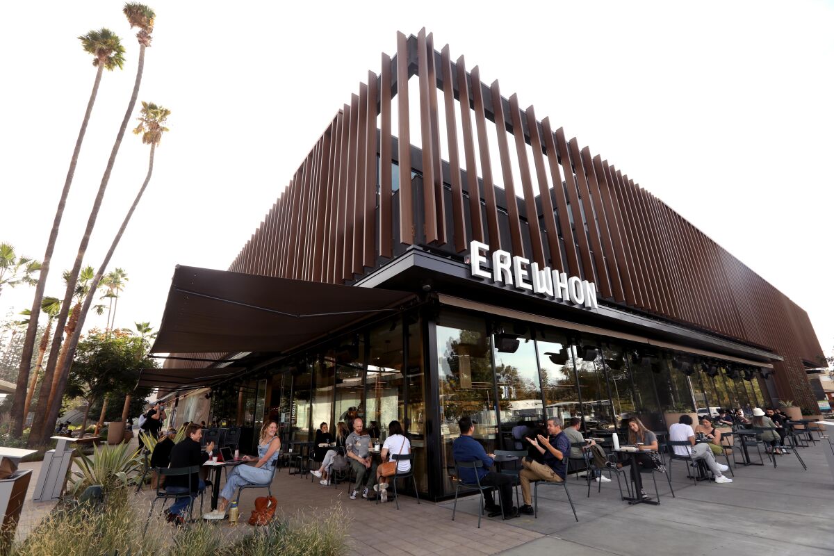 People eat outside the new Erewhon in Studio City. 