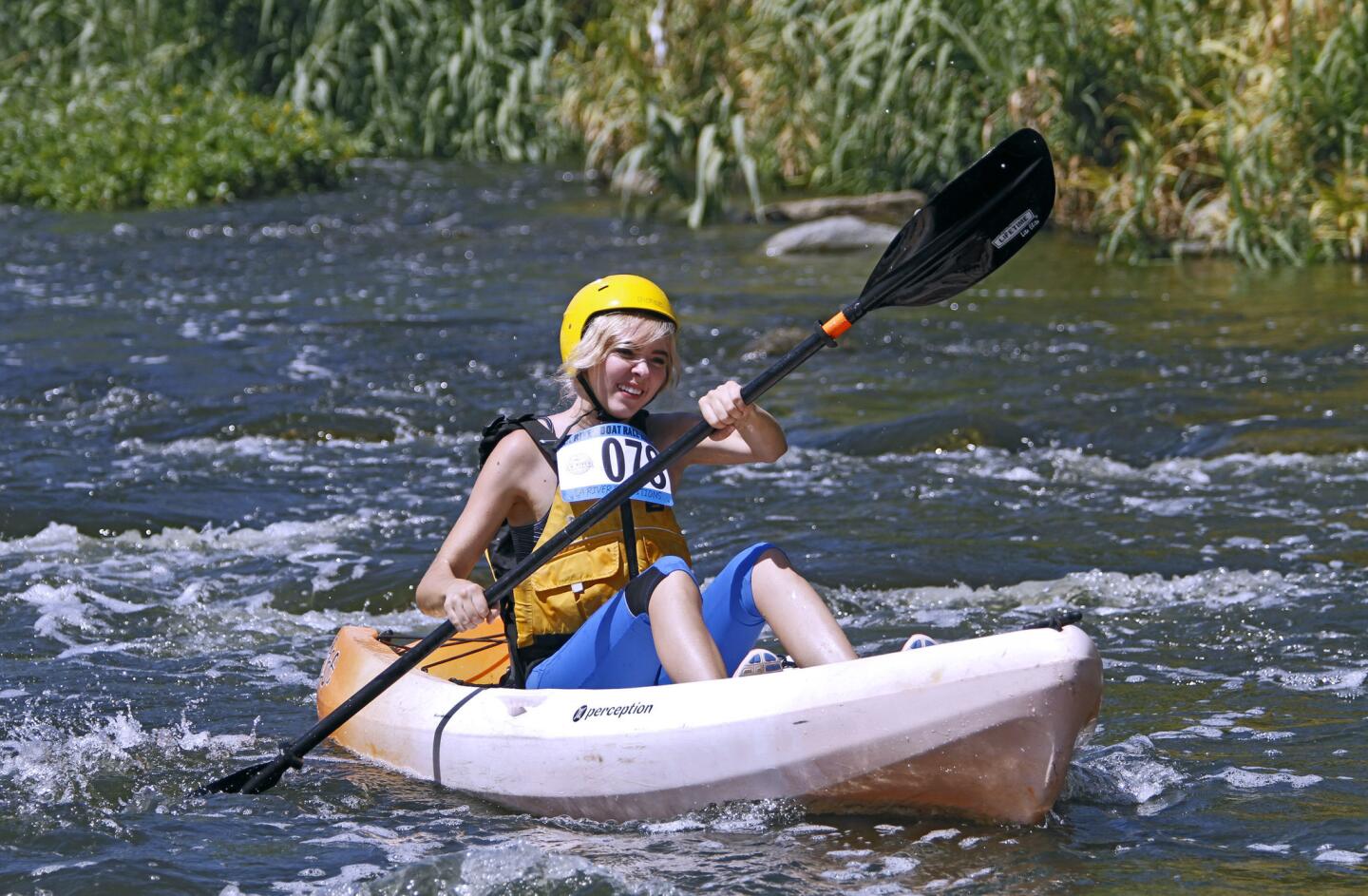 Shawnee Badger, 21 of Valencia, heads down river in the L.A. River Expeditions first annual L.A. River boat race at Rattlesnake Park just south of Fletcher Drive in L.A. on Saturday, Aug. 30, 2014.