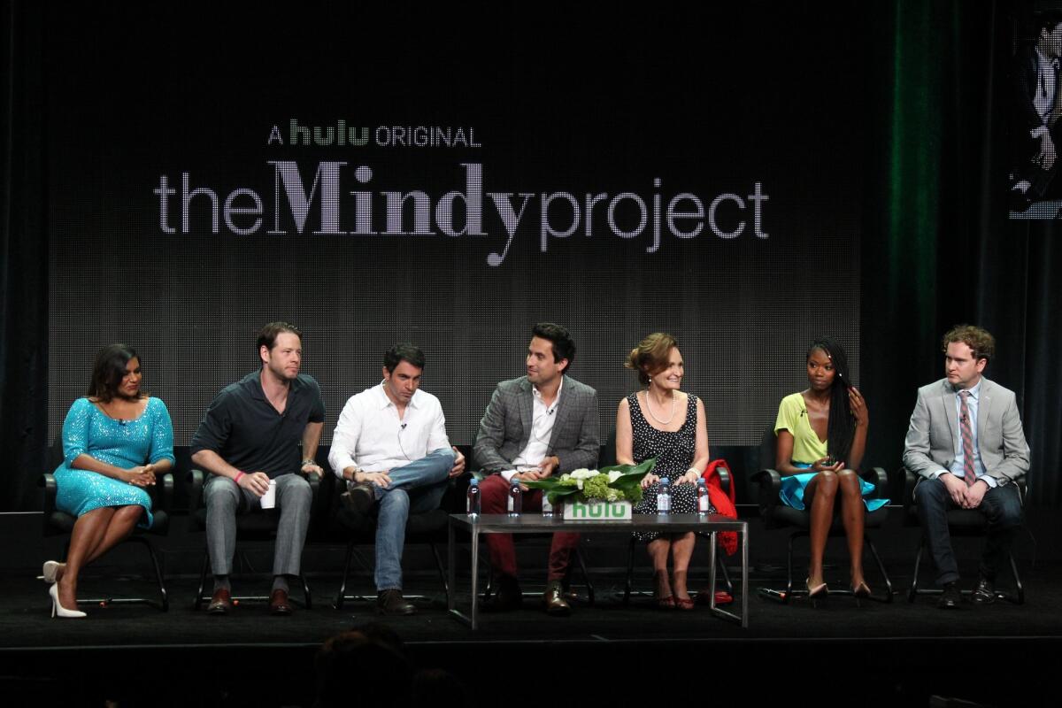 Actress and executive producer Mindy Kaling, left, actors Ike Barinholtz, Chris Messina, Ed Weeks, Beth Grant, Xosha Roquemore, and executive producer Matt Warburton speak during "The Mindy Project" panel at Hulu's TCA presentation Sunday.