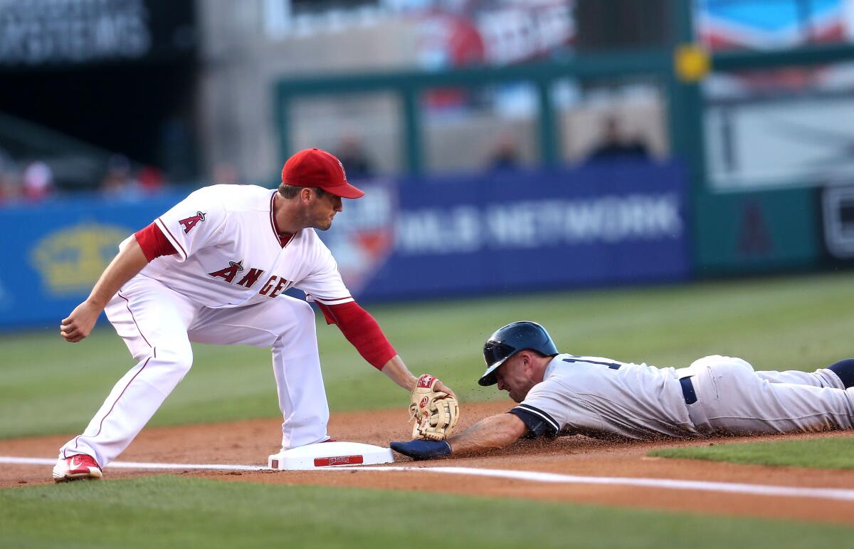 Angels third baseman David Freese tags out Yankees baserunner Brett Gardner during a game in June 2015.