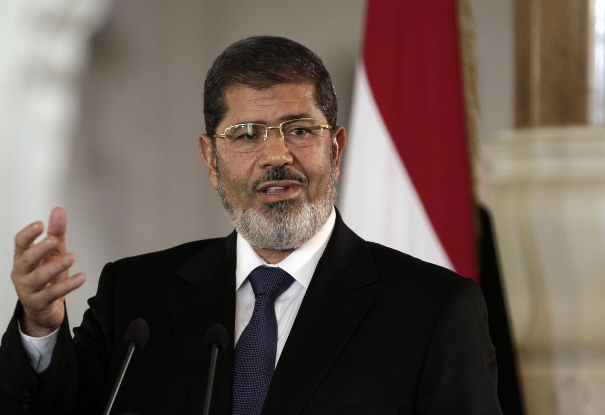 Then-Egyptian President Mohammed Morsi speaks to reporters at the presidential palace in Cairo in July 2012.