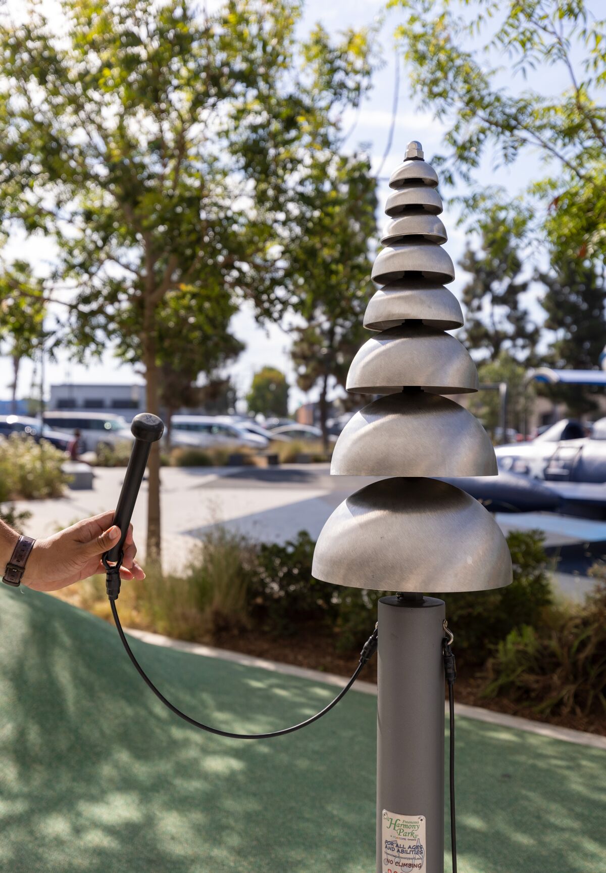 Pagoda bells are a part of a new outdoor musical instrument play area installed outside of the Donald Dungan Library.