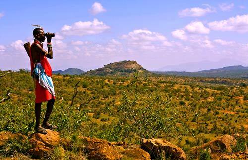 Ngasakwe "Gus" Kipise, a Samburu warrior and guide, keeps watch for wildlife on a walking safari in Kenya.