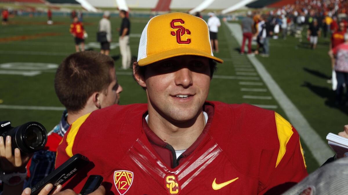 USC quarterback Cody Kessler speaks with reporters after the Trojans' 2014 spring game at the Coliseum on April 19.
