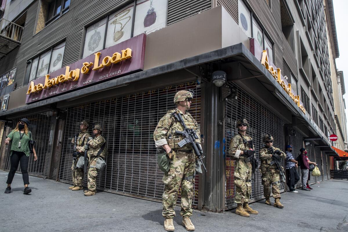 National Guard troops stand watch at 6th and South Hill streets in the heart of L.A.'s Jewelry District.