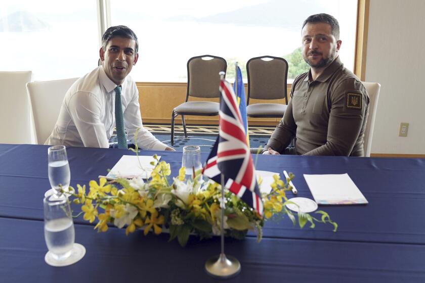 Britain's Prime Minister Rishi Sunak, left, and Ukraine President Volodymyr Zelenskyy meet at the Grand Prince Hotel, during the G7 Summit in Hiroshima, Japan, Saturday, May 20, 2023. (Stefan Rousseau/Pool via AP)