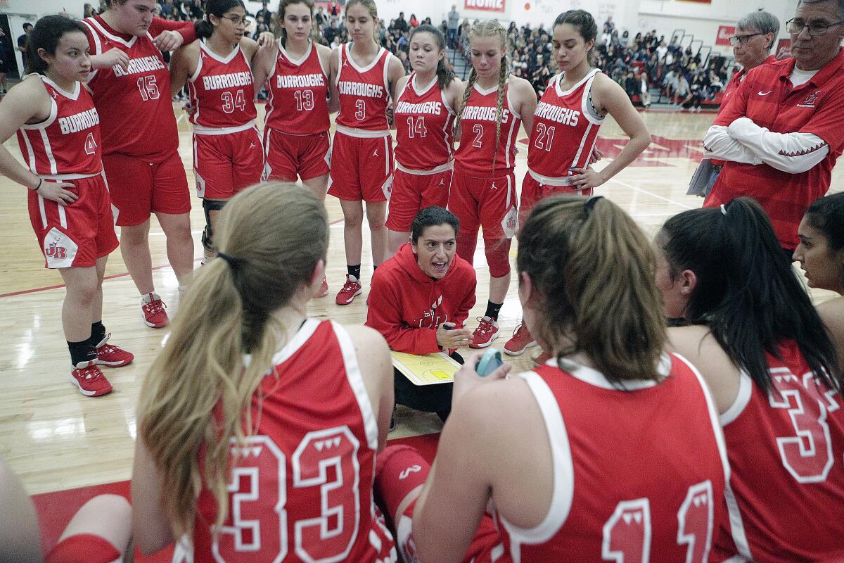 Burroughs' head coach Vicky Oganyan and the Burroughs High girls' basketball team took on San Clemente in a CIF semifinal playoff game Saturday.