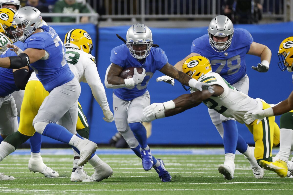 Detroit Lions running back Jamaal Williams carries the ball against the Green Bay Packers.