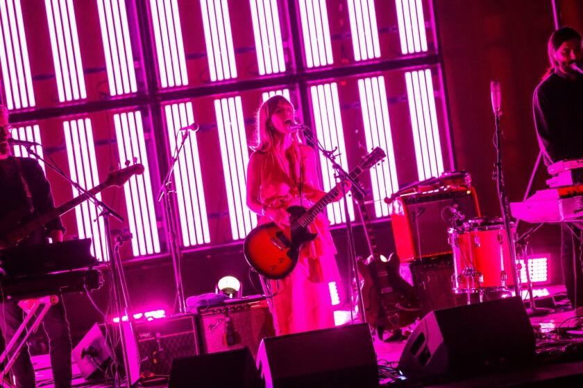 LOS ANGELES, CALIF. -- SATURDAY, MAY 6, 2017: Guitarist and singer, Leslie Feist, center, known professionally as Feist, performs at The Palace, in Los Angeles, Calif., on May 6, 2017. (Marcus Yam / Los Angeles Times)