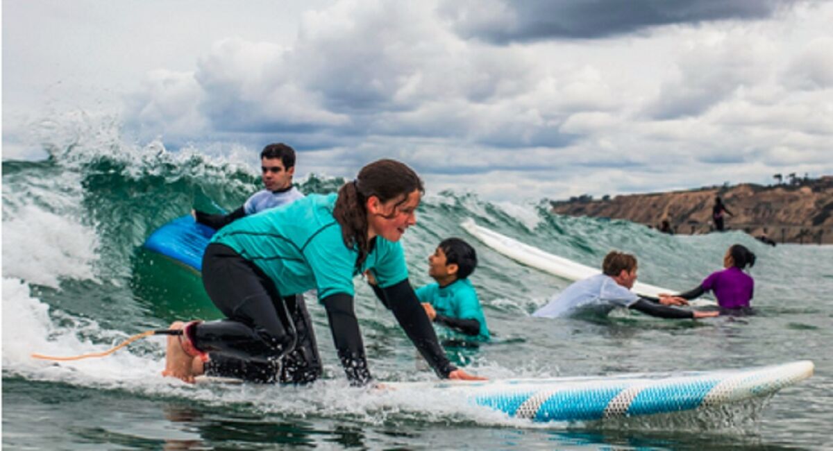 Area children learn to surf through the mentorship program ReSurf.