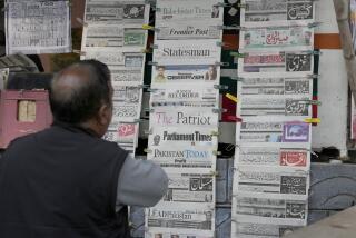 A Pakistani checks morning newspapers covering front page story of Iran's strike, at a stall in Islamabad, Pakistan, Thursday, Jan. 18, 2024. Pakistan's air force launched retaliatory airstrikes early Thursday on Iran allegedly targeting militant positions, an attack that killed at least several people and further raised tensions between the neighboring nations. (AP Photo/Anjum Naveed)