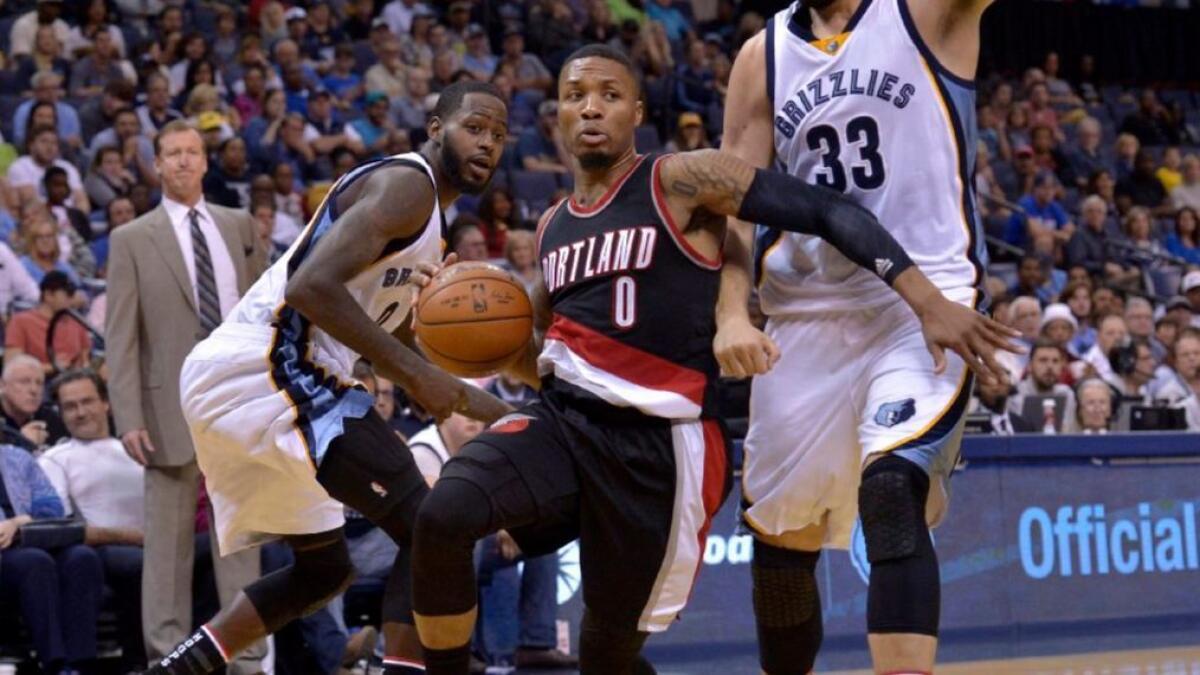 Trail Blazers guard Damian Lillard drives to the hoop during a game against the Grizzlies on Nov. 6.