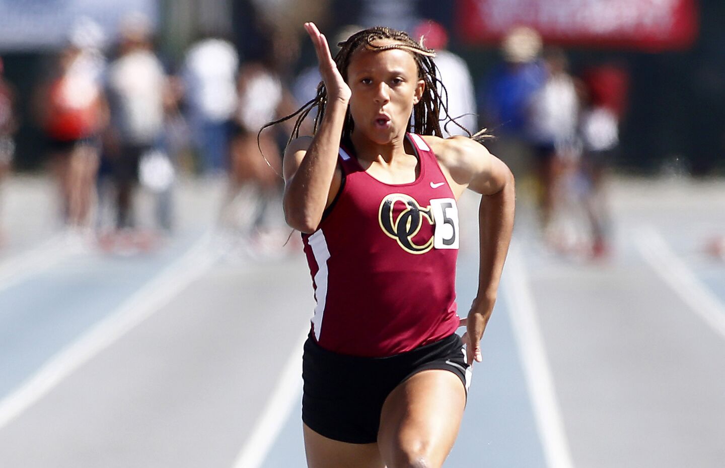 Oaks Christian sprinter Lauren Rain Williams wins the Division 4 girls' 100-meter dash during the CIF Southern Section finals at Cerritos College.