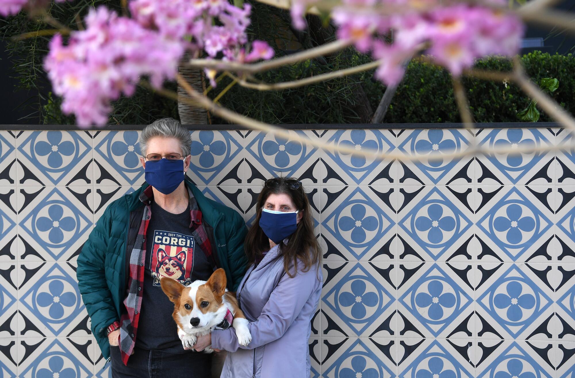 Ted and Sandy Rogers hold their new corgi.