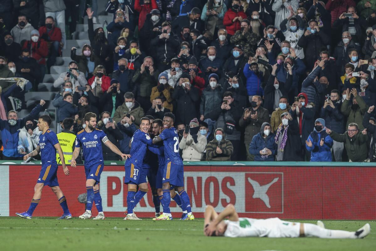 Real Madrid's Eden Hazard, third right, celebrates after scoring his side's second goal during a Copa del Rey soccer match between Elche and Real Madrid at Martinez Valero stadium in Elche, Spain, Thursday, Jan. 20, 2022. (AP Photo/Alberto Saiz)