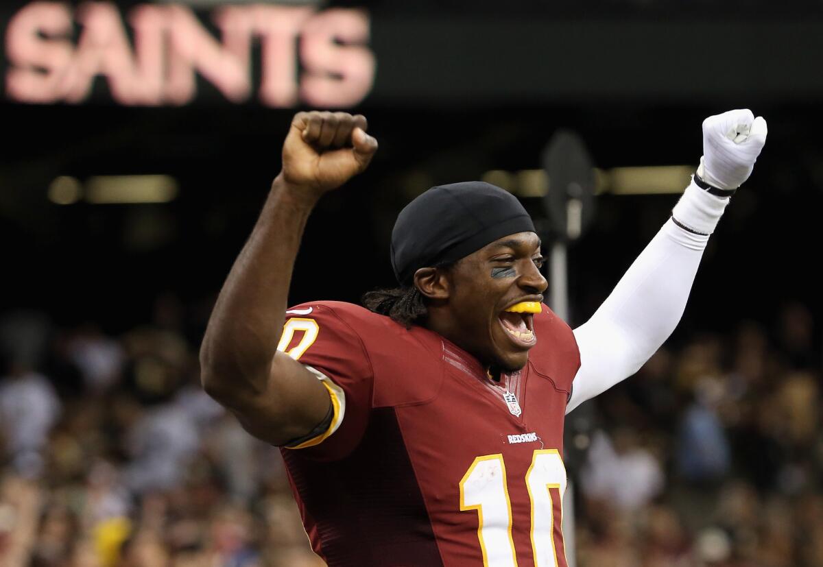 Robert Griffin III celebrates the Redskins' victory Sunday.